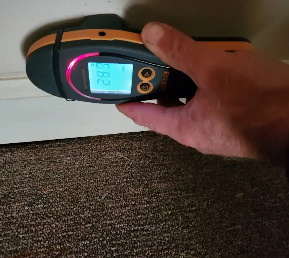 Moisture detection at baseboard during Storm Damage Restoration in Pendleton